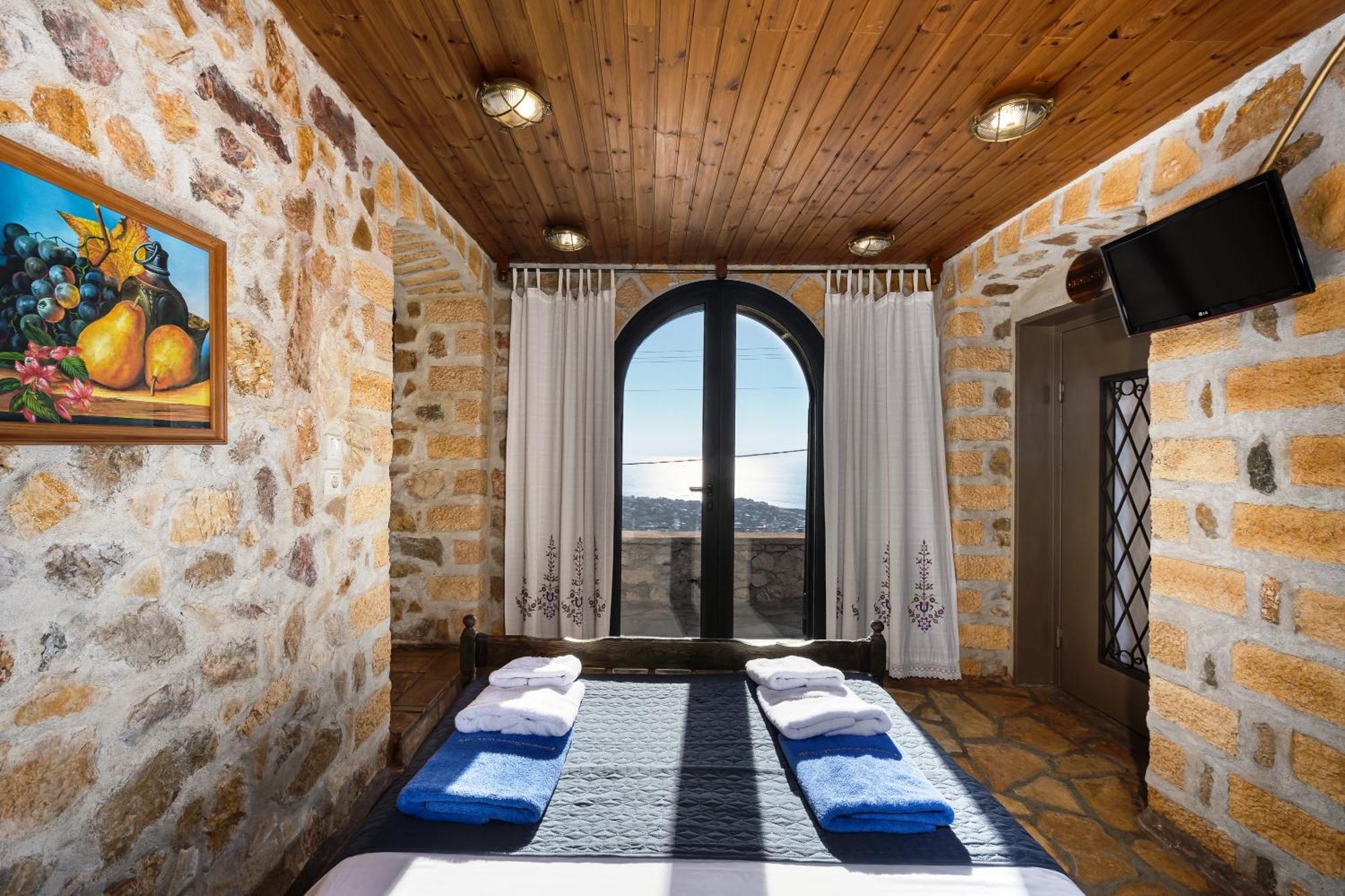 Four Seasons Stonework Castle Villa Lagonisi Bagian luar foto